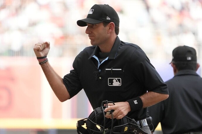 Home plate umpire Pat Hoberg calls an out during a game between the Padres and Giants in April 2023.